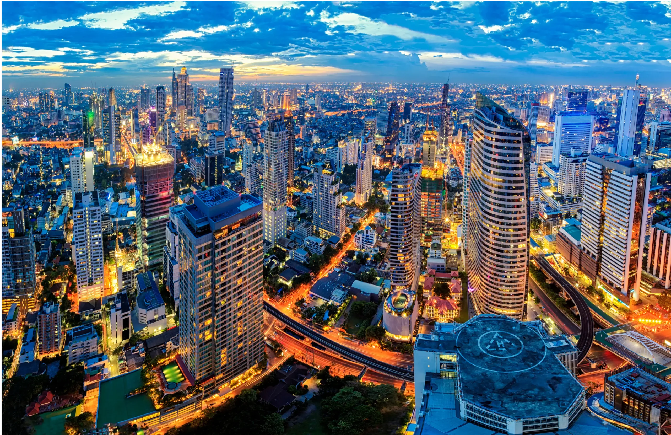 A vibrant view of Bangkok nightlife with neon lights, rooftop bars, and crowded street markets