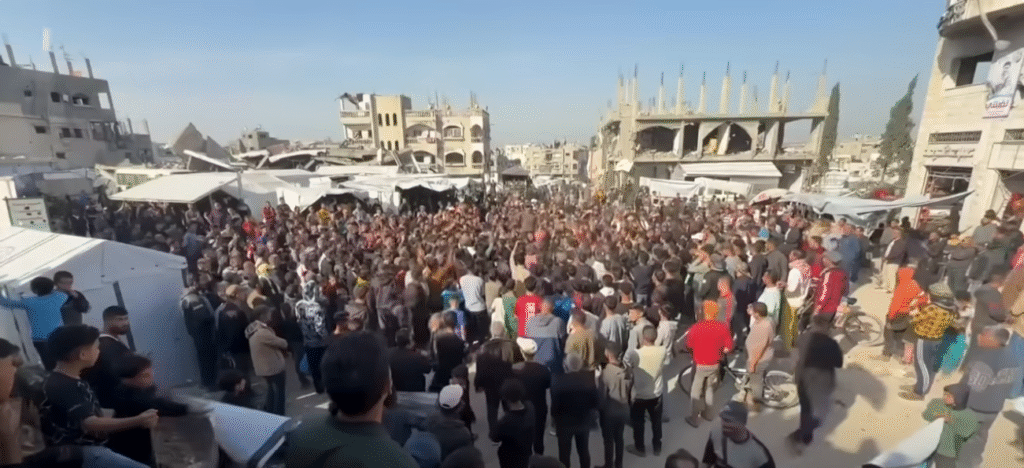Hamas security forces confronting protesters in Gaza, with visible tension and unrest.