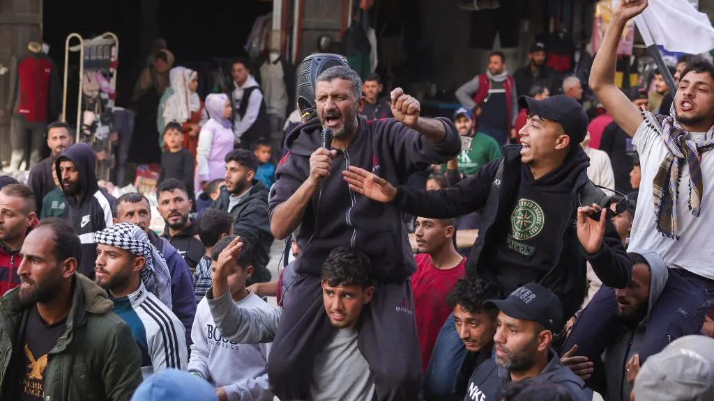 Hamas security forces confronting protesters in Gaza, with visible tension and unrest.